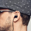 dBud ear plugs hearing protection shown in ear